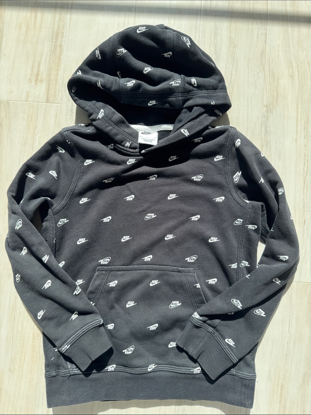Nike Black Hoodie with White Swoosh Pattern